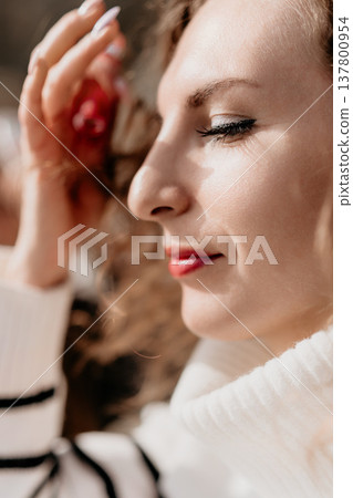 Woman portrait profile close-up of a young woman with eyes closed in sunlight reflecting a serene and tranquil mood Woman portrait profile close-up of a young woman with eyes closed in sunlight reflecting a serene and tranquil mood 137800954