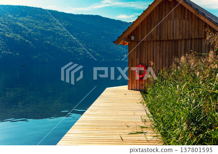 Fishing wooden hun on the lakeshore. Millstatt am See, Lake Millstatt in Carinthia, Austria, Europe Fishing wooden hun on the lakeshore. Millstatt am See, Lake Millstatt in Carinthia, Austria, Europe 137801595