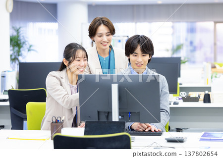 Men and women working in business offices Men and women working in business offices 137802654