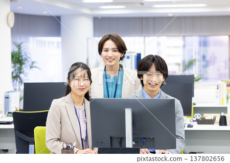 Men and women working in business offices Men and women working in business offices 137802656