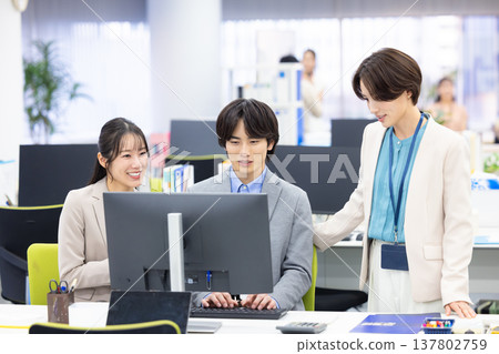 Men and women working in business offices Men and women working in business offices 137802759