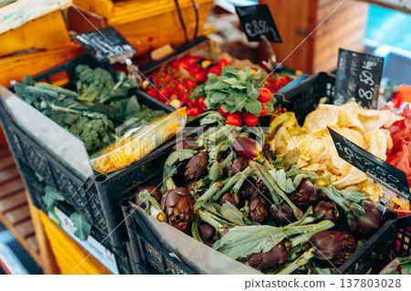 Fresh vegetables and fruits for sale at a local market in the morning hours Fresh vegetables and fruits for sale at a local market in the morning hours 137803028