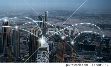 City skyline shows digital connections and technology in urban setting City skyline shows digital connections and technology in urban setting 137803157
