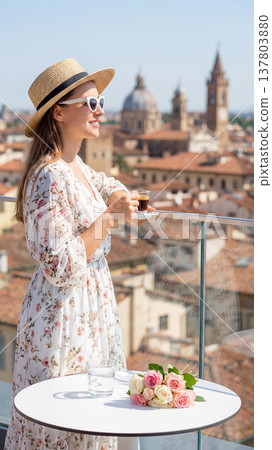 Elegant woman in floral dress and straw hat enjoying espresso on terrace overlooking European city rooftops on a sunny summer morning, feeling relaxed and content Elegant woman in floral dress and straw hat enjoying espresso on terrace overlooking European city rooftops on a sunny summer morning, feeling relaxed and content 137803880