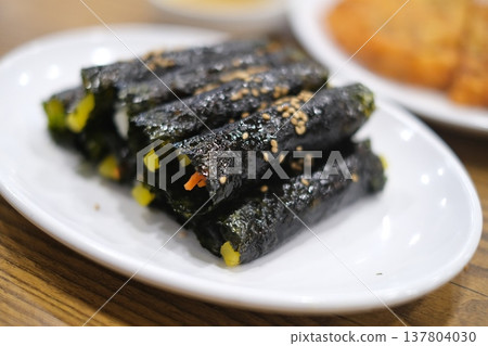 Freshly made kimbap from a Korean market 137804030