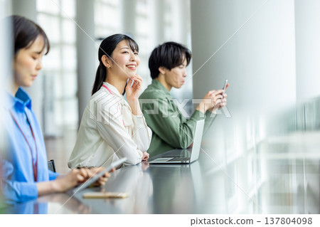Men and women working in cafes Men and women working in cafes 137804098