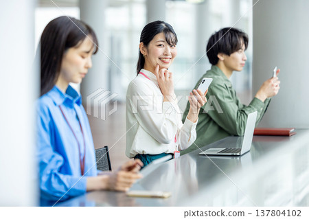 Men and women working in cafes Men and women working in cafes 137804102