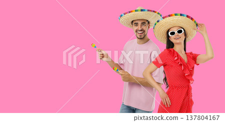 Couple celebrates Cinco de Mayo in festive hats Couple celebrates Cinco de Mayo in festive hats 137804167