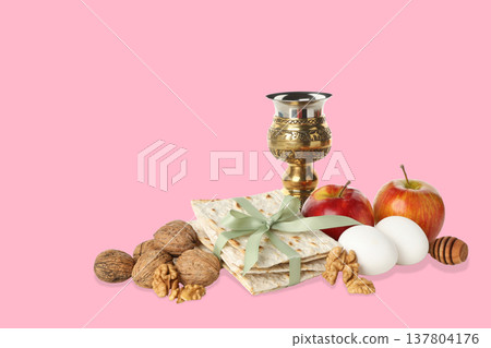 Display of Passover foods like matzah, nuts, apples, and eggs 137804176