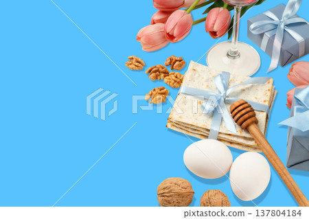 Table setting for Passover includes matzah, wine, and flowers 137804184