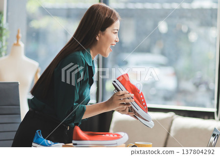 Starting small businesses SME owners female entrepreneurs check online orders to prepare to pack the boxes, sell to customers, sme business ideas online. Starting small businesses SME owners female entrepreneurs check online orders to prepare to pack the boxes, sell to customers, sme business ideas online. 137804292
