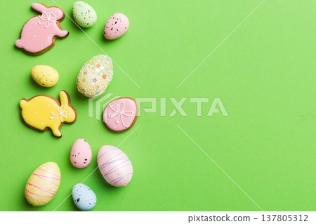 Happy Easter concept. Preparation for holiday. Easter eggs on colored background. flat lay top view copy space banner Happy Easter concept. Preparation for holiday. Easter eggs on colored background. flat lay top view copy space banner 137805312