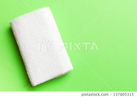 Top view of white towels with copy space on colored background Top view of white towels with copy space on colored background 137805315