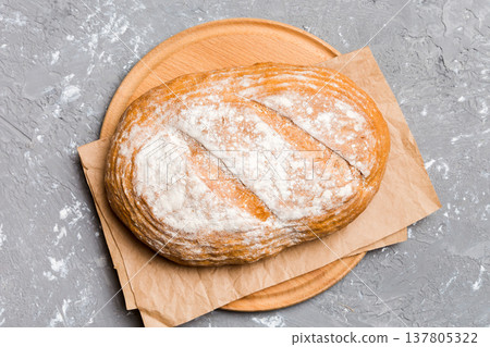 Freshly baked bread on cutting board against white wooden background. top view bread with copy space 137805322