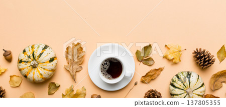 Flat lay composition with colorful Autumn cup of coffee and leaves on a color background. top view Flat lay composition with colorful Autumn cup of coffee and leaves on a color background. top view 137805355