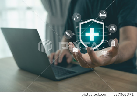 Digital Health Solutions Concept with Medical Icons and Laptop Displaying Remote Health Care Services and Secure Patient Data Management 137805371