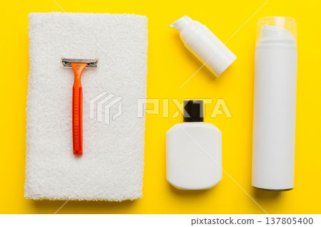 shaving man set. shaving machine, towel, lotion and shaving foam on colored background. Men bath Accessories top view shaving man set. shaving machine, towel, lotion and shaving foam on colored background. Men bath Accessories top view 137805400