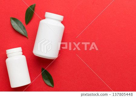 supplement pills with medicine bottle health care and medical top view. Vitamin tablets. Top view mockup bottle for pills and vitamins with green leaves, natural organic bio supplement, copy space supplement pills with medicine bottle health care and medical top view. Vitamin tablets. Top view mockup bottle for pills and vitamins with green leaves, natural organic bio supplement, copy space 137805448