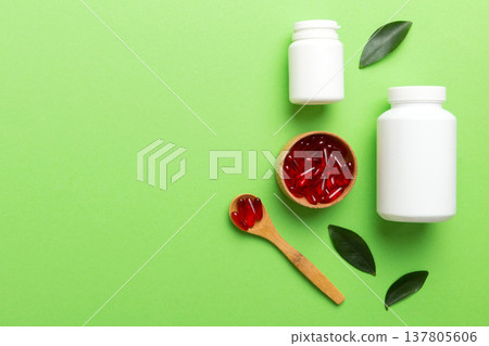 different drugs and health supplement pills with medicine bottle health care and medical top view. Vitamin tablets. Bottle with colored pills on table background. Multivitamins different drugs and health supplement pills with medicine bottle health care and medical top view. Vitamin tablets. Bottle with colored pills on table background. Multivitamins 137805606