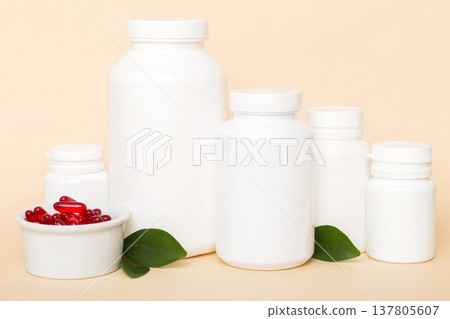 different drugs and health supplement pills with medicine bottle health care and medical top view. Vitamin tablets. Bottle with colored pills on table background. Multivitamins 137805607