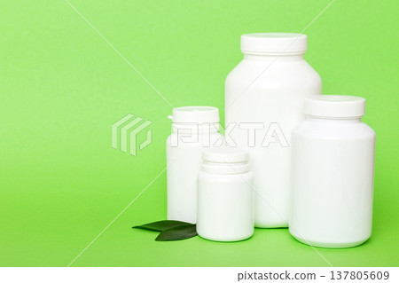 supplement pills with medicine bottle health care and medical top view. Vitamin tablets. Top view mockup bottle for pills and vitamins with green leaves, natural organic bio supplement, copy space supplement pills with medicine bottle health care and medical top view. Vitamin tablets. Top view mockup bottle for pills and vitamins with green leaves, natural organic bio supplement, copy space 137805609