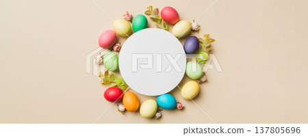 round frame multicolored Easter eggs with white blank paper on a brown background, close-up, space for text, blank for design, selective focus, tinted image round frame multicolored Easter eggs with white blank paper on a brown background, close-up, space for text, blank for design, selective focus, tinted image 137805696