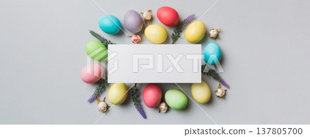 round frame multicolored Easter eggs with white blank paper on a brown background, close-up, space for text, blank for design, selective focus, tinted image round frame multicolored Easter eggs with white blank paper on a brown background, close-up, space for text, blank for design, selective focus, tinted image 137805700