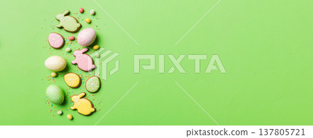 holiday preparation Multi colors Easter eggs with cookies on colored background . Pastel color Easter eggs. holiday concept with copy space holiday preparation Multi colors Easter eggs with cookies on colored background . Pastel color Easter eggs. holiday concept with copy space 137805721