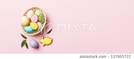 Multi colors Easter eggs in the woven basket on colored background . Pastel color Easter eggs. holiday concept with copy space Multi colors Easter eggs in the woven basket on colored background . Pastel color Easter eggs. holiday concept with copy space 137805722