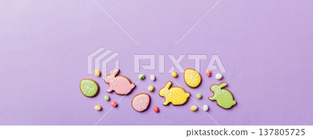 holiday preparation Multi colors Easter eggs with cookies on colored background . Pastel color Easter eggs. holiday concept with copy space holiday preparation Multi colors Easter eggs with cookies on colored background . Pastel color Easter eggs. holiday concept with copy space 137805725