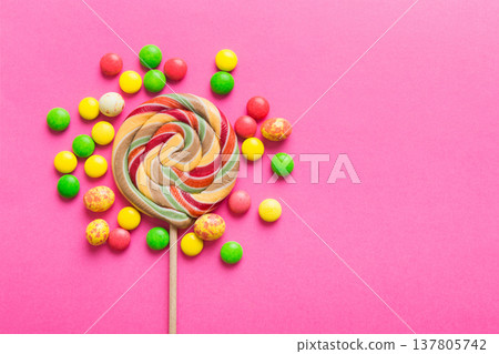 Tasty appetizing Party Accessories Happy Birthday Sweet. Different types of candies on colored background, copy space. Colorful birthday party background Tasty appetizing Party Accessories Happy Birthday Sweet. Different types of candies on colored background, copy space. Colorful birthday party background 137805742