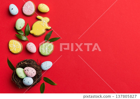 Colorful easter eggs in nest on table background with copy space top view Colorful easter eggs in nest on table background with copy space top view 137805827