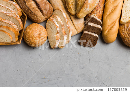 Homemade natural breads. Different kinds of fresh bread as background, top view with copy space 137805859