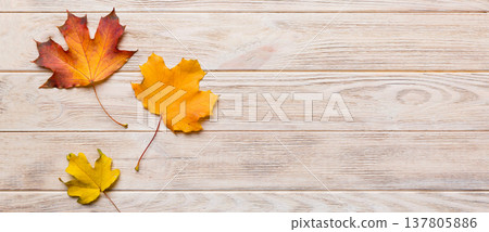 Autumn composition. Pattern made of dried leaves and other design accessories on table. Flat lay, top view Autumn composition. Pattern made of dried leaves and other design accessories on table. Flat lay, top view 137805886