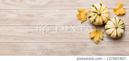 Autumn composition. Pattern made of dried leaves and other design accessories on table. Flat lay, top view Autumn composition. Pattern made of dried leaves and other design accessories on table. Flat lay, top view 137805907