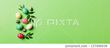 Colorful Easter eggs with spring flower leaf isolated over white background. Colored Egg Holiday border 137806036