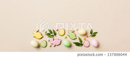 holiday preparation Multi colors Easter eggs with cookies on colored background . Pastel color Easter eggs. holiday concept with copy space holiday preparation Multi colors Easter eggs with cookies on colored background . Pastel color Easter eggs. holiday concept with copy space 137806044