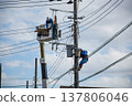 Worker doing electrical work on utility pole 137806046