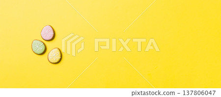 holiday preparation Multi colors Easter eggs with cookies on colored background . Pastel color Easter eggs. holiday concept with copy space holiday preparation Multi colors Easter eggs with cookies on colored background . Pastel color Easter eggs. holiday concept with copy space 137806047