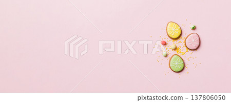 holiday preparation Multi colors Easter eggs with cookies on colored background . Pastel color Easter eggs. holiday concept with copy space holiday preparation Multi colors Easter eggs with cookies on colored background . Pastel color Easter eggs. holiday concept with copy space 137806050