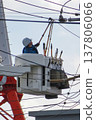 Worker doing electrical work on utility pole 137806066