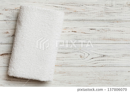 Top view of white towels with copy space on colored background 137806070