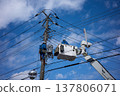 Worker doing electrical work on utility pole 137806071