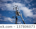 Worker doing electrical work on utility pole 137806073