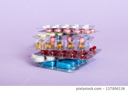 too many different pill cartridges stacked. selective Focus. Packs of blister pills with tablets. Colored pastilles packages. A pile of medicine in blister packs. Pharmaceutical blister packs too many different pill cartridges stacked. selective Focus. Packs of blister pills with tablets. Colored pastilles packages. A pile of medicine in blister packs. Pharmaceutical blister packs 137806136