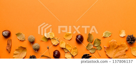Autumn composition. Pattern made of dried leaves and other design accessories on table. Flat lay, top view 137806137
