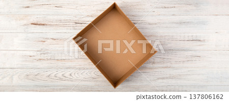 Empty Cardboard box on a white wooden background top view 137806162
