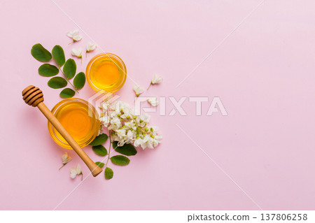 honey jar with acacia flowers and leaves. fresh honey top view flat lay 137806258