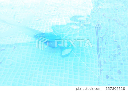 pool vacuum cleaner in the water. dirty pool water surface, season luxury life concept top view pool vacuum cleaner in the water. dirty pool water surface, season luxury life concept top view 137806518