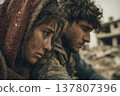 A brother and sister huddled together amidst the rubble. A brother and sister huddled together amidst the rubble. 137807396